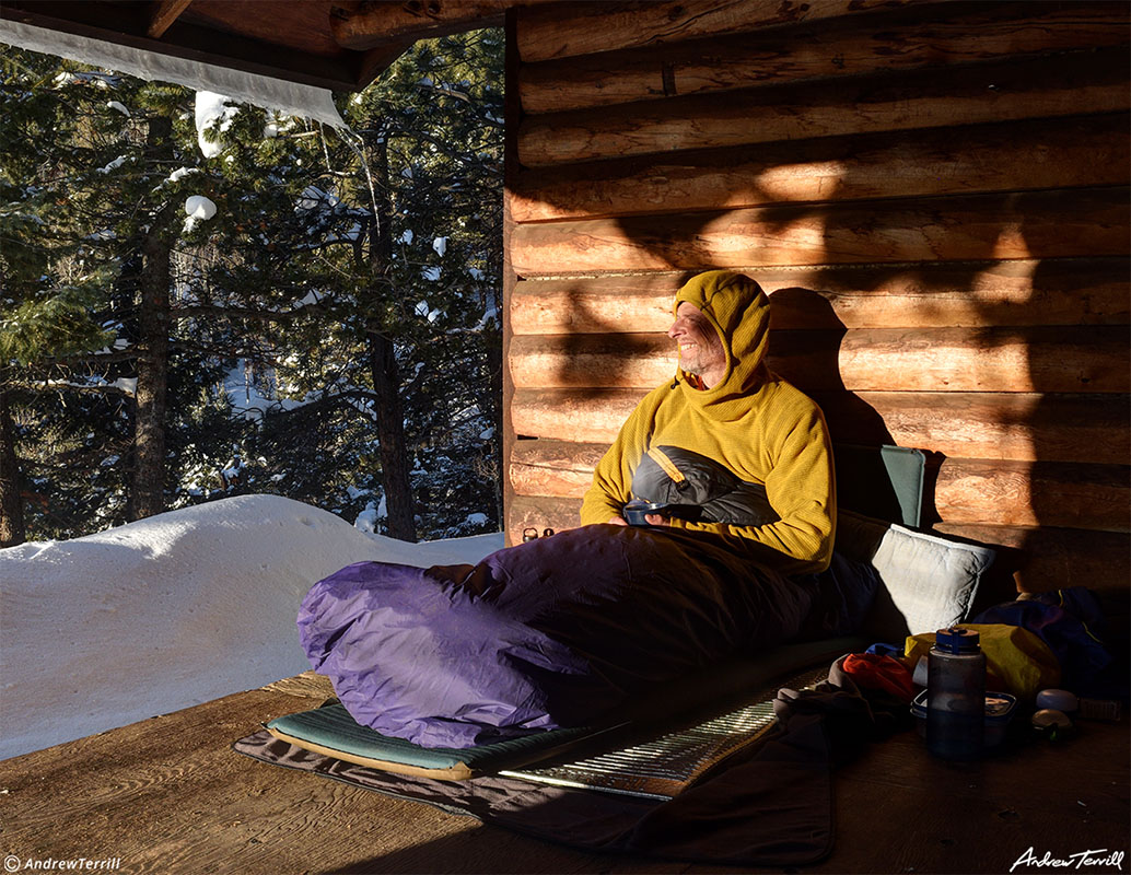 andrew terrill hiking enjoying morning sun in shelter