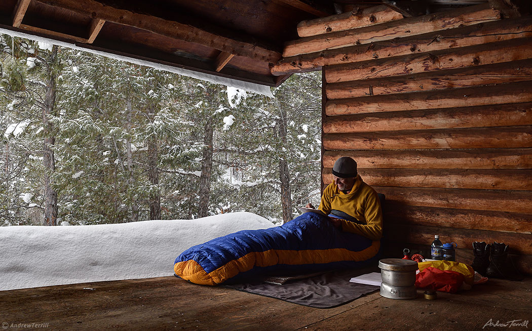 andrew terrill writing in lean to shelter in winter colorado