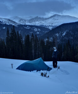 cold winter camp and hiker in mount evans wilderness colorado