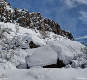 deep snow beneath golden cliffs on north table mountain mesa golden colorado march 2021