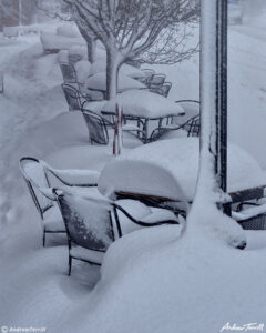 outside cafe restaurant chairs and tables in deep snow golden colorado march 2021