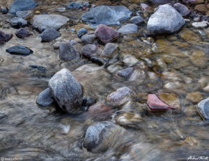 colorful granite rocks in mountain river colorado