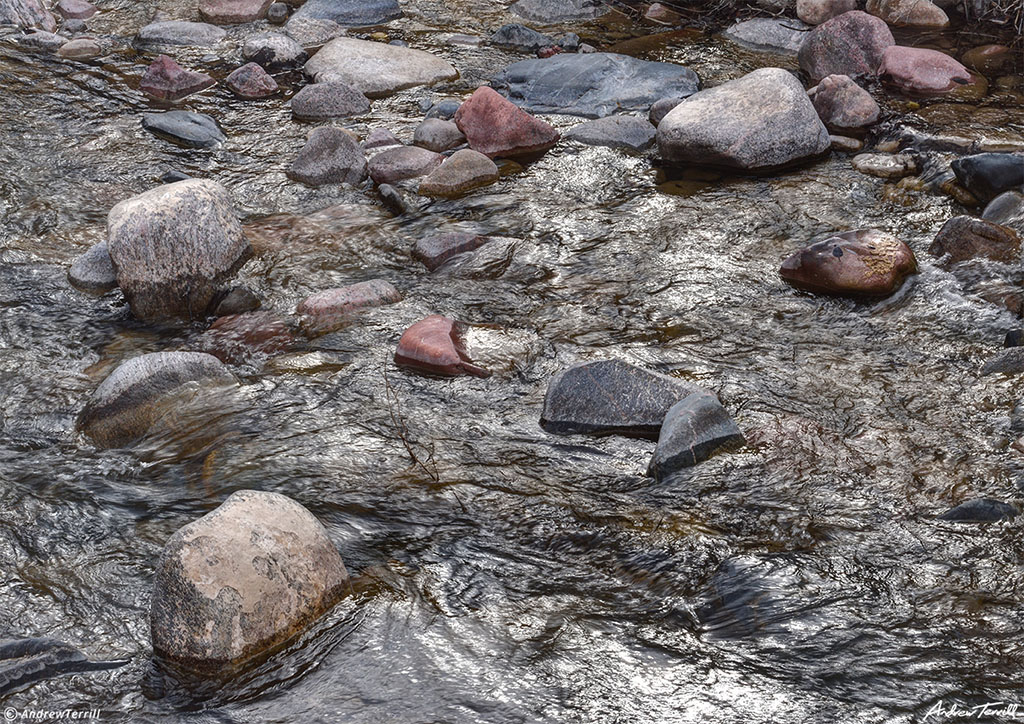 mountain creek and rocks in colorado silver light