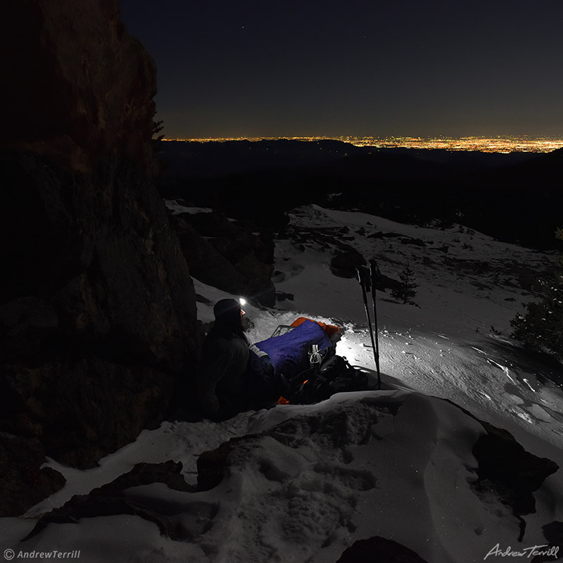 mountain summit bivvy night above city lights january 2021