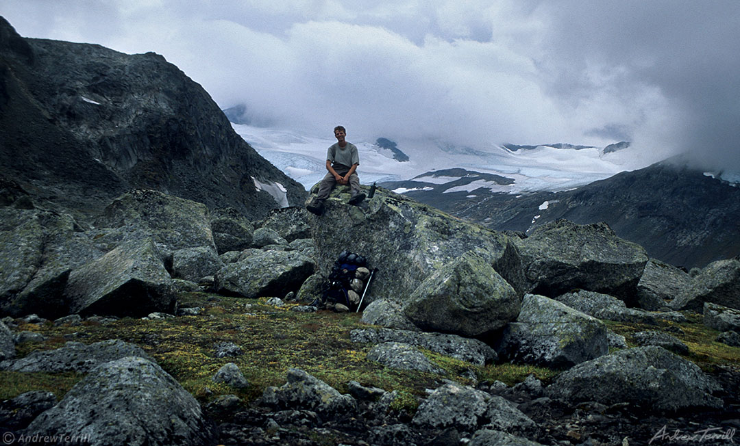 andrew terrill sitting on rocks in narvik fjells and mountains arctic norway with glaciers