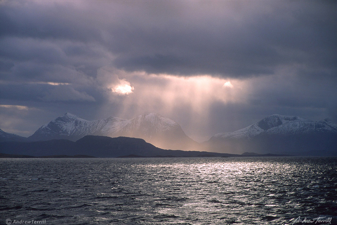 sunbeams across a fjord in arctic norway rays of light