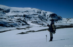 hiker using map in snow winter wilderness norway hardangervidda