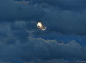 full moon shinning through clouds may 25 2021