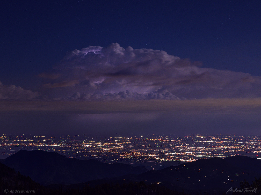 nighttime thundercloud above sea of lights may 2021 colorado