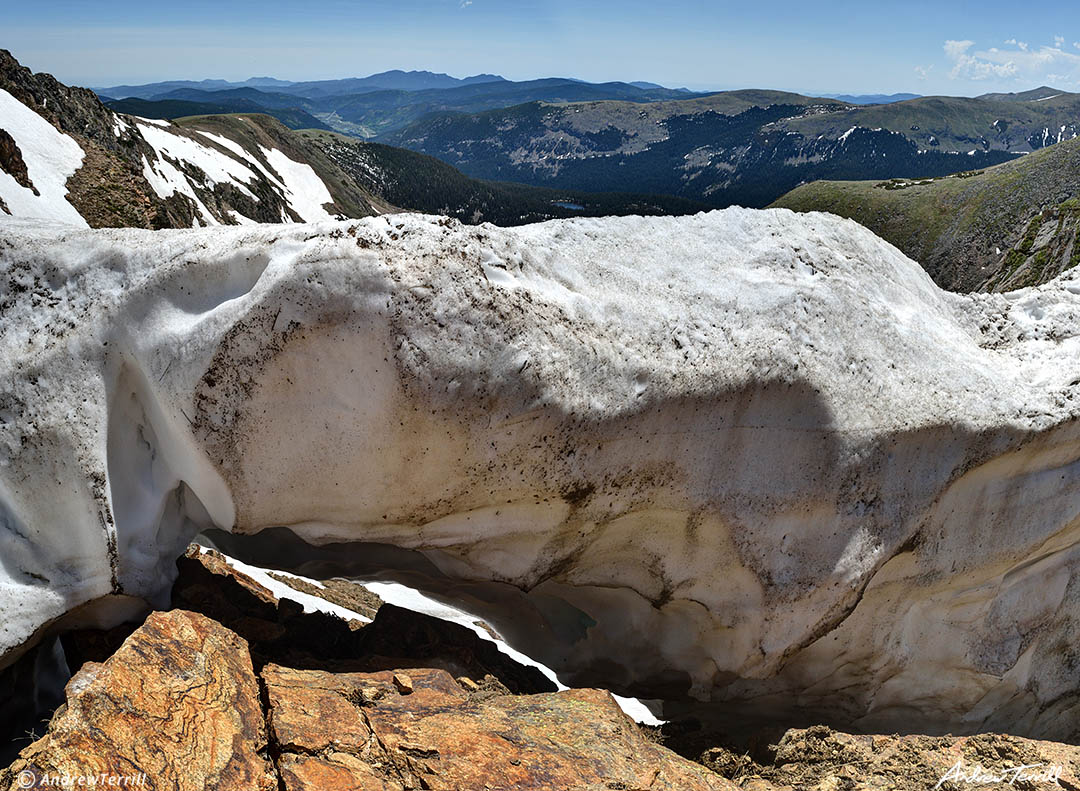 old snow drift making an arch james peak wilderness colorado june