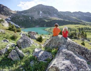 children on rock above lake ann colorado