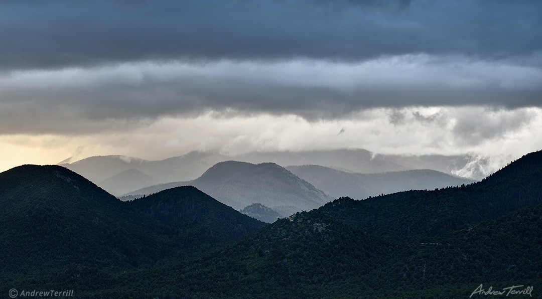 rain clouds over forests beneath the sangre di cristo range