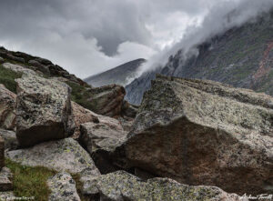 boulders mountains and storm clouds colorado