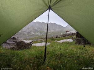 mountains in rain from inside a tarp