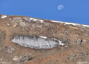 old snow patch and moon indian peaks wilderness colorado