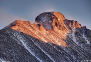 Longs Peak Rocky Mountain National Park in high winds at sunset