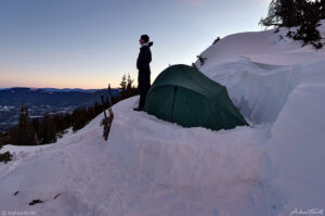 camper in winter staring at view