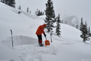 preparing foundation in snow for igloo