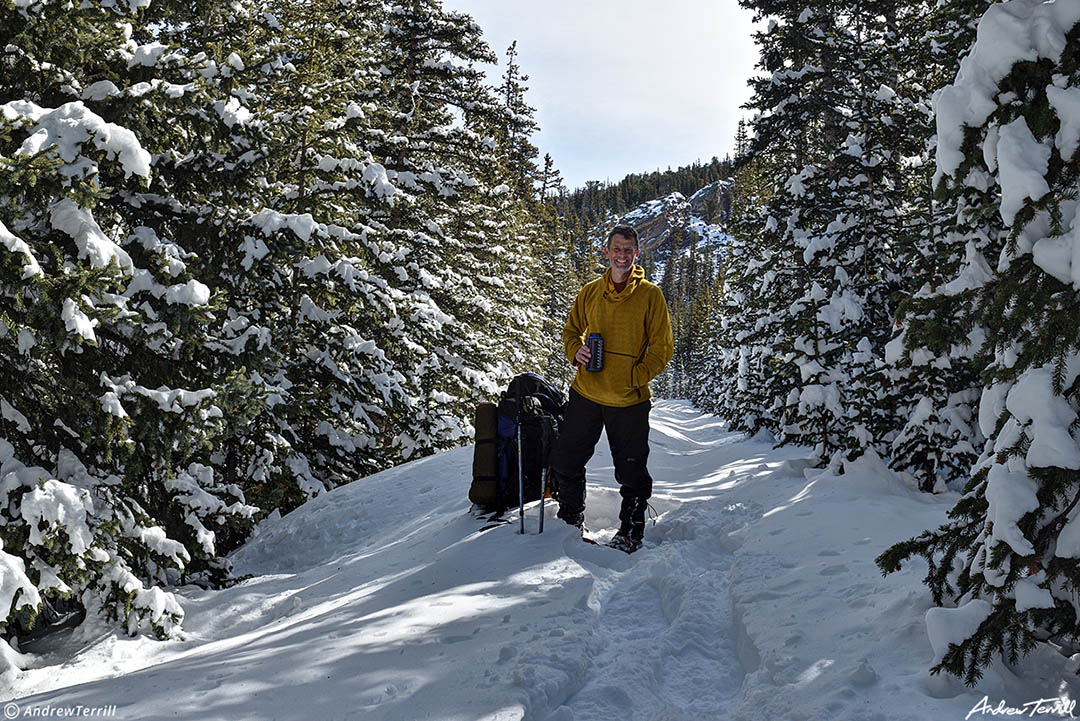 andrew terrill taking a break in the winter forest colorado