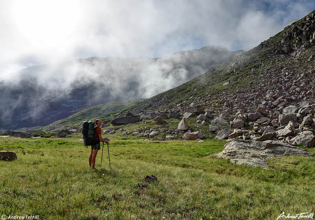 backpacker hiker and fog mount evans colorado mount blue sky