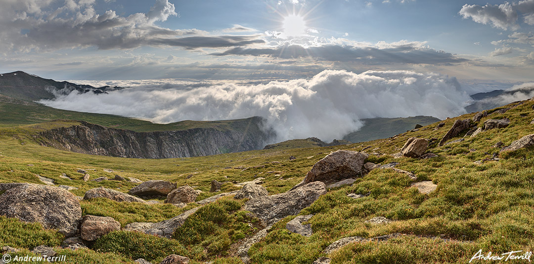 cloud sea beneath mount evans mount blue sky