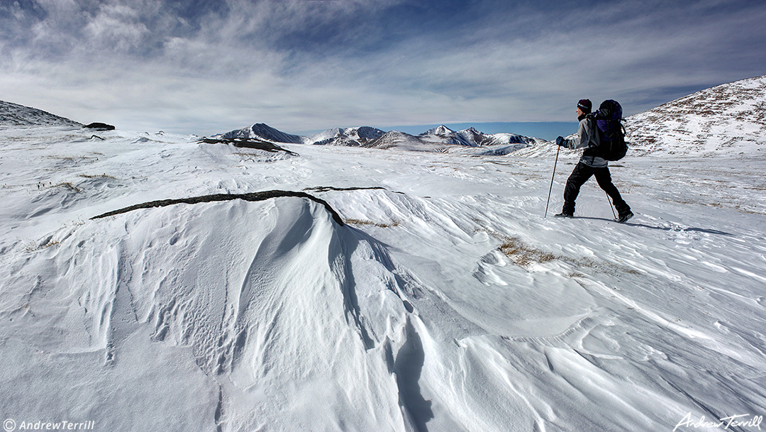 striding across the plateau near mount evans mount blue sky