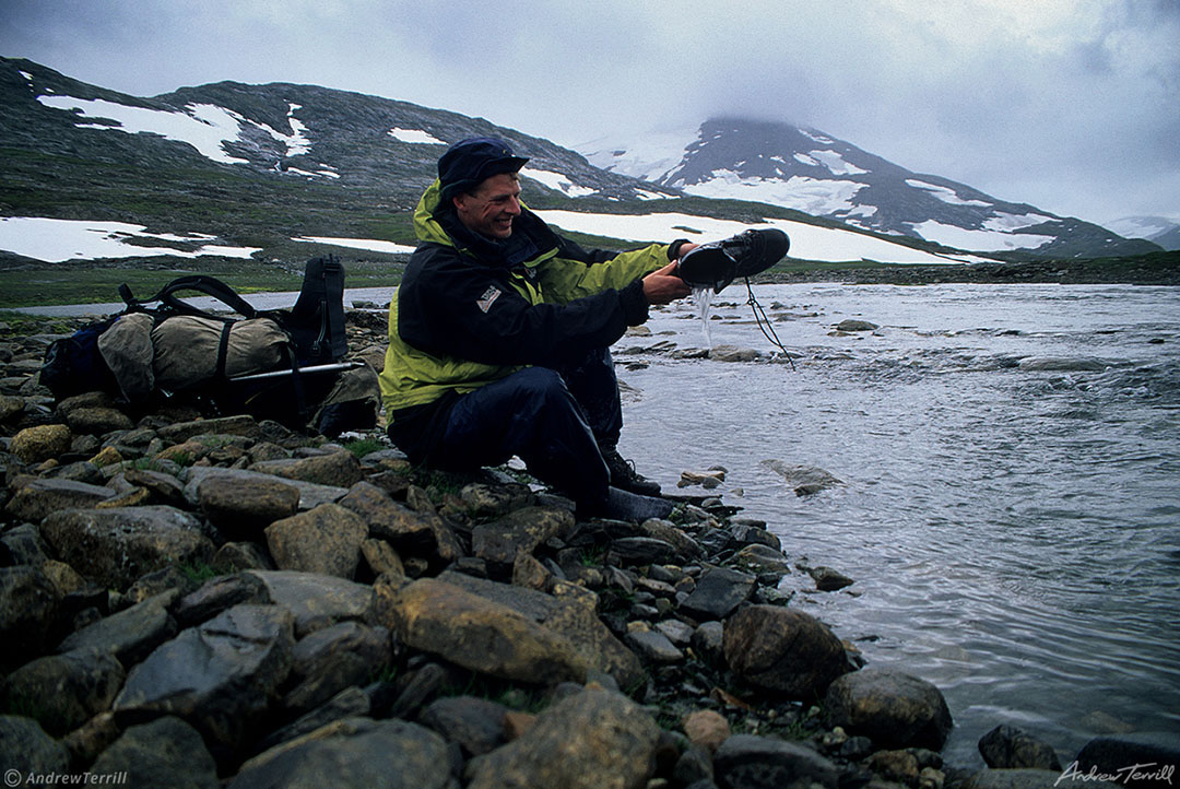 enjoying the Arctic emptying boots after yet another river crossing Svartisen norway