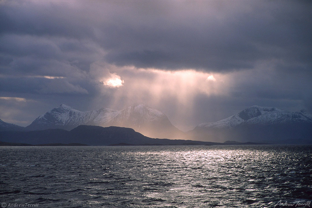 sunbeams over an arctic fjord norway