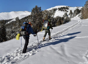 Hikers in snow heading uphill -March 18 2023