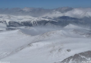 012 strong winds and spindrift blowing across the Hells Hole peaks