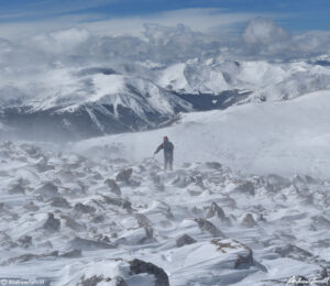 029 mountaineer crossing rough ground on Mount Bierstadt colorado winter