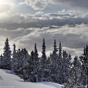 clearing winter storm clouds over rocky mountains in colorado