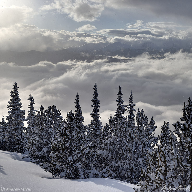 clearing winter storm clouds over rocky mountains in colorado