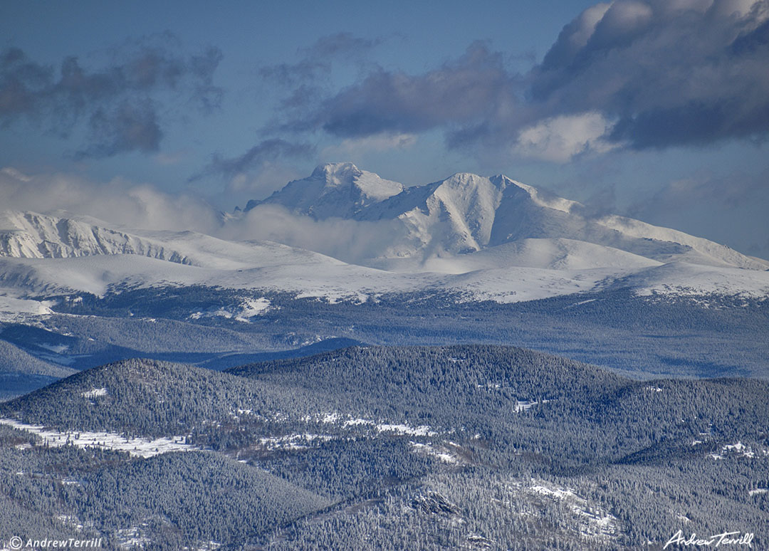 clearing storm clouds Longs Peak Rocky Mountain National Park winter snow