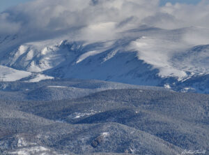 arapaho peak and lonely cabin in winter forest