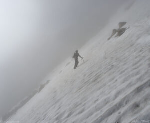 Mountaineer on snowfield Mount Bierstadt - 8 July 2023