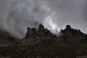 a rock towers and storm clouds colorado