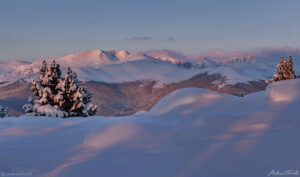 Sunrise light on Mount Blue Sky, seen from nearby Chief Mountain, 2021.