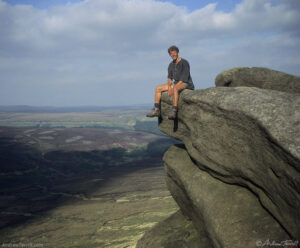 kinder scout sitting on rocks cropped