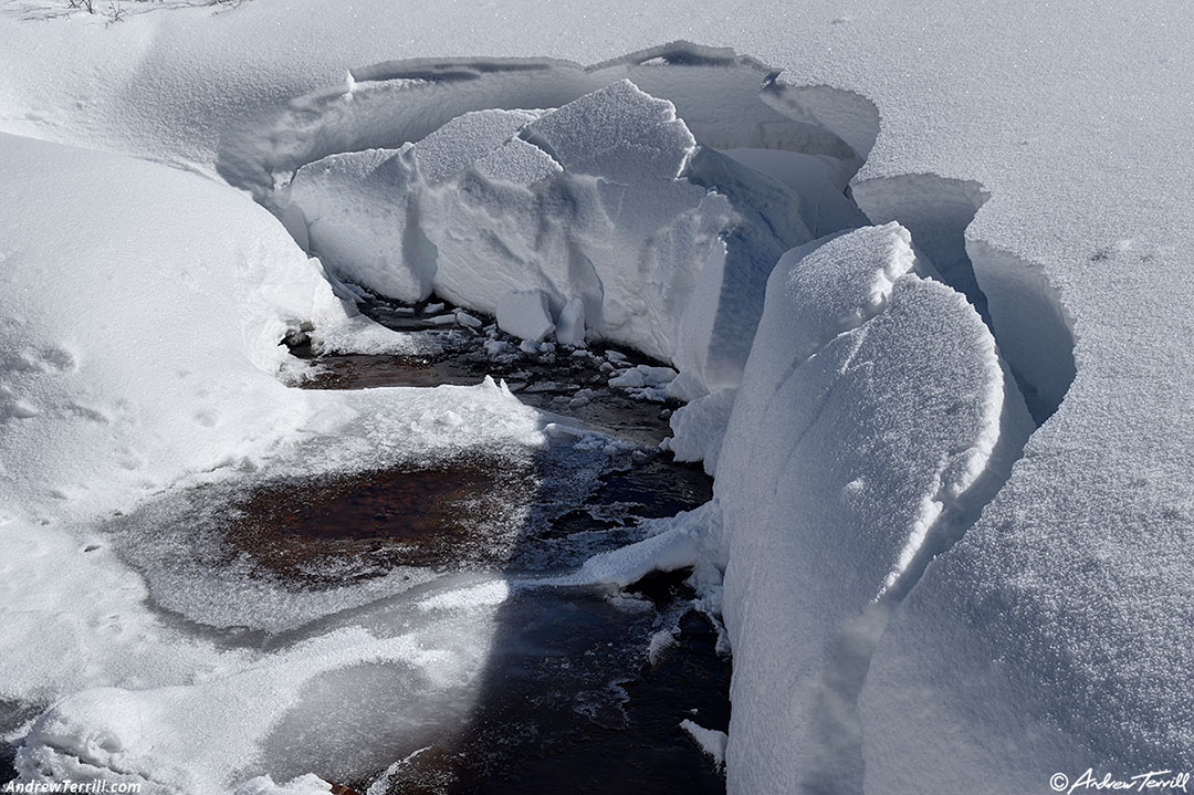 fractured snow and creek