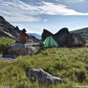 Blog - 021 hiker on rock in camp morning